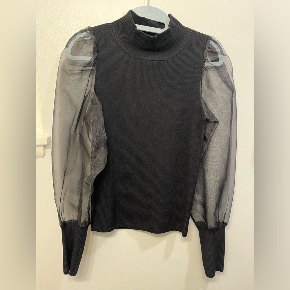 Black mock neck sweater with sheer sleeves